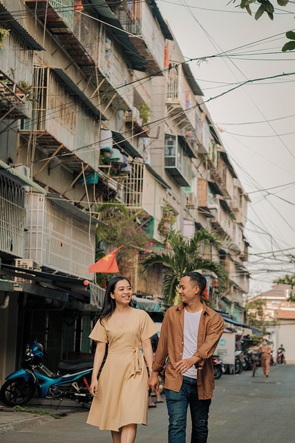 Community garden with raised vegetable beds and families gardening together in Vancouver neighbourhood park